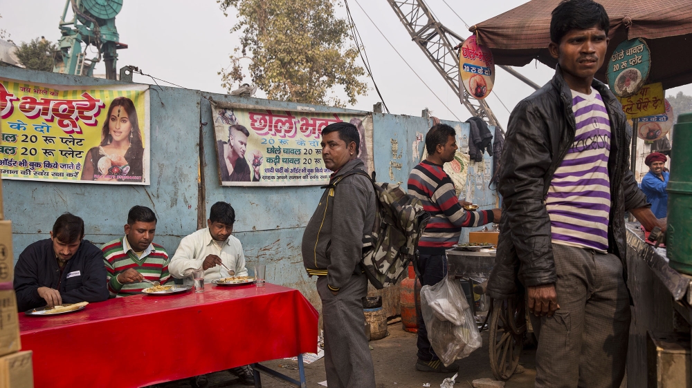 
The main opposition Congress party has promised to introduce a minimum income guarantee for the poor if it wins the elections [Tsering Topgyal/AP]
