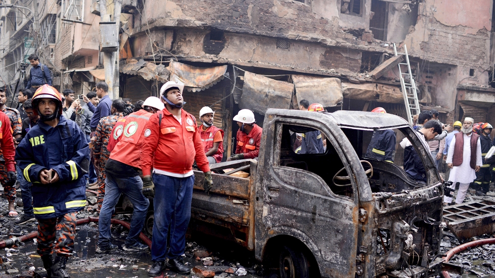 A devastating fire raced through at least five buildings in an old part of Bangladesh's capital and killed scores of people [Mahmud Hossain Opu/AP Photo]