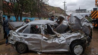 Damaged vehicles are seen after a flash flooding in Shiraz [Reuters]
