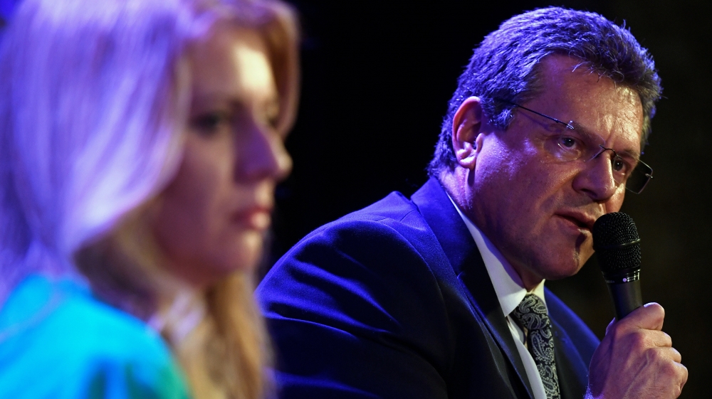 Caputova and Sefcovic (right) will compete in a runoff election scheduled for March 30 [Radovan Stoklasa/Reuters]