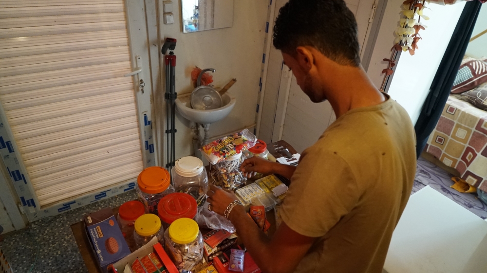 
Ahmed Muhammad Ali says his mother sold all her jewellery so the family could start their business [Faisal Edroos/Al Jazeera] 
