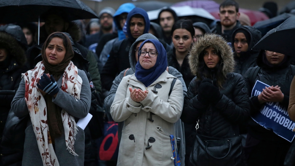 Muslims pray during a vigil for victims of the mosque shootings in New Zealand, outside city hall in Toronto