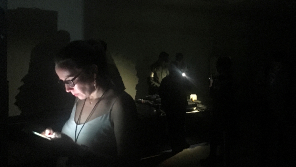 Passengers are seen during a blackout at Simon Bolivar international airport in Caracas