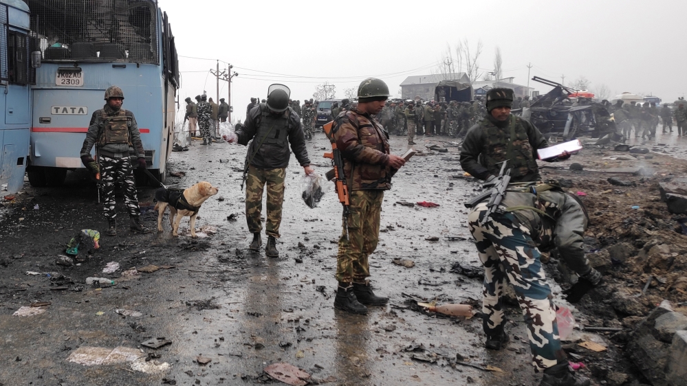 Indian soldiers examine the debris after an explosion in Lethpora in south Kashmir''s Pulwama district