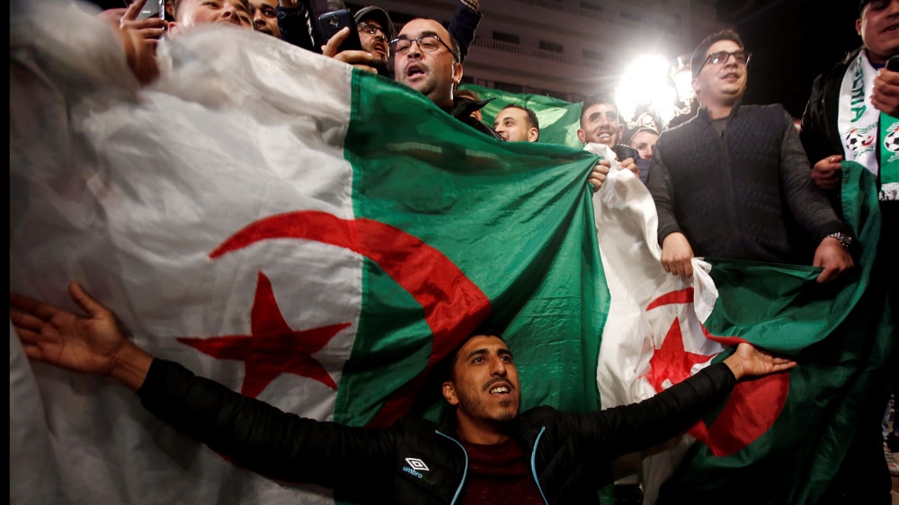 People celebrated on the streets after Bouteflika submitted his resignation [Ramzi Boudina/Reuters]