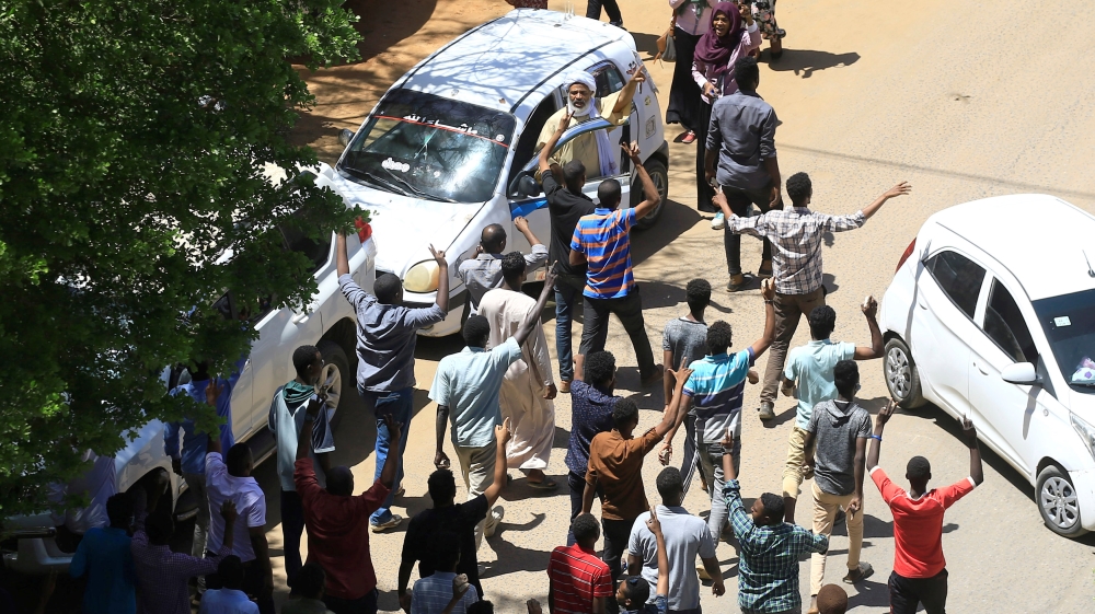 Sudanese demonstrators chant slogans during a protest demanding
