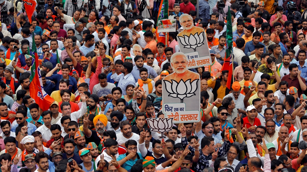 Supporters of Bharatiya Janata Party celebrate after the election results in New Delhi