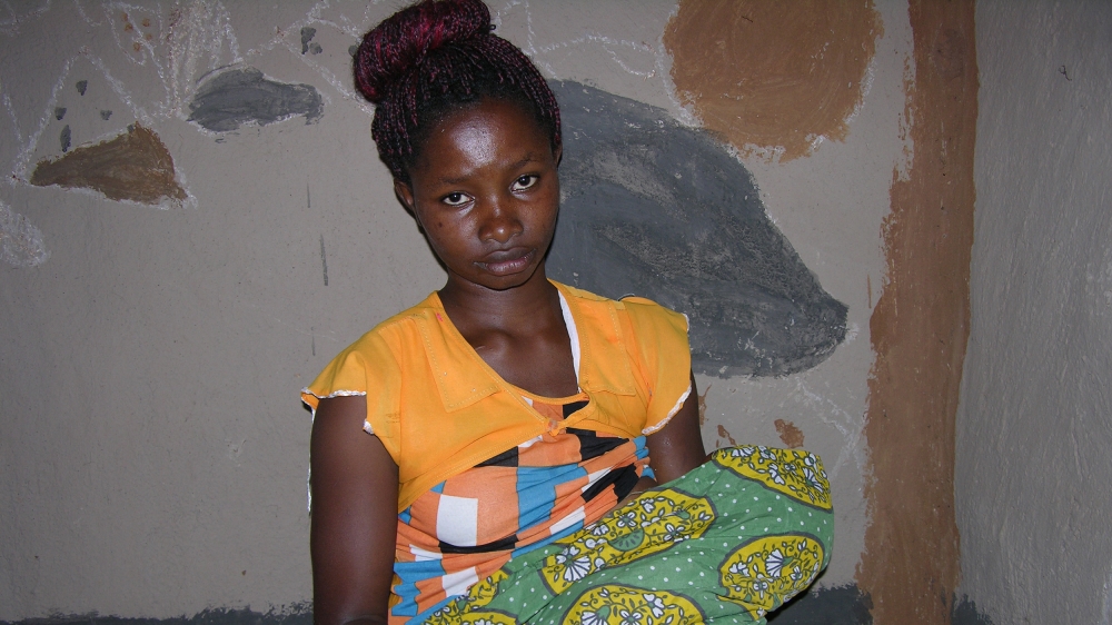 Grace Boke, 19, with one of her three daughters [Mary Mwendwa/Al Jazeera]