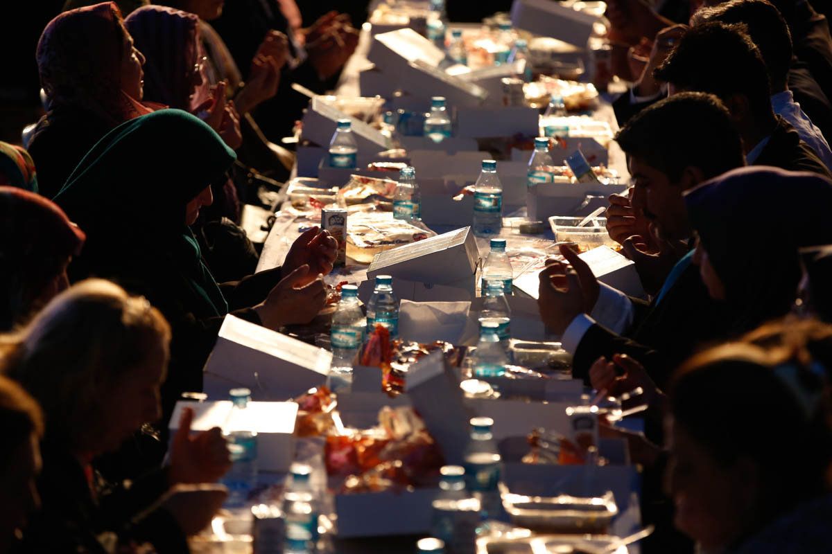 People offer their prayers before breaking their fast in the historic Sultanahmet district of Istanbul, Monday, May 6, 2019, on the first day of the fasting month of Ramadan. Muslims throughout the wo