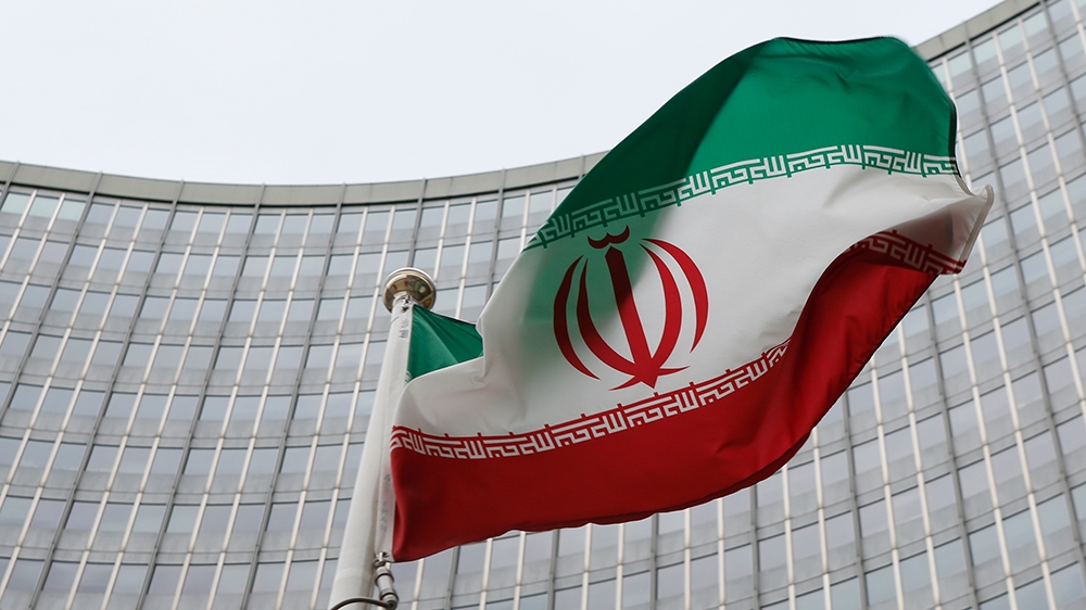 An Iranian flag flutters in front of the International Atomic Energy Agency (IAEA) headquarters in Vienna, Austria, January 15, 2016. REUTERS/Leonhard Foeger