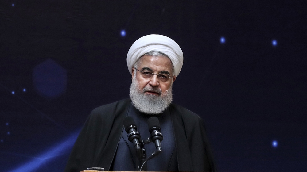 In this photo released by the official website of the office of the Iranian Presidency, President Hassan Rouhani speaks during a ceremony commemorating "National Day of Nuclear Technology" in Tehran,