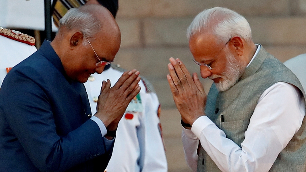 India''s President Ram Nath Kovind greets India''s Prime Minister Narendra Modi after his oath during a swearing-in ceremony at the presidential palace in New Delhi, India May 30, 2019