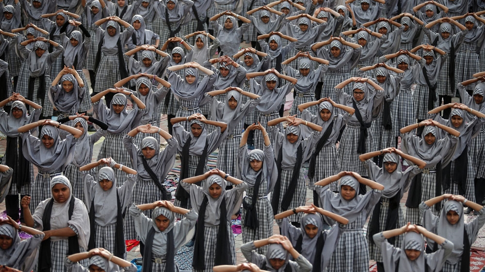 Muslim students attend a yoga lesson at a school in the run-up to International Yoga Day in Ahmedabad