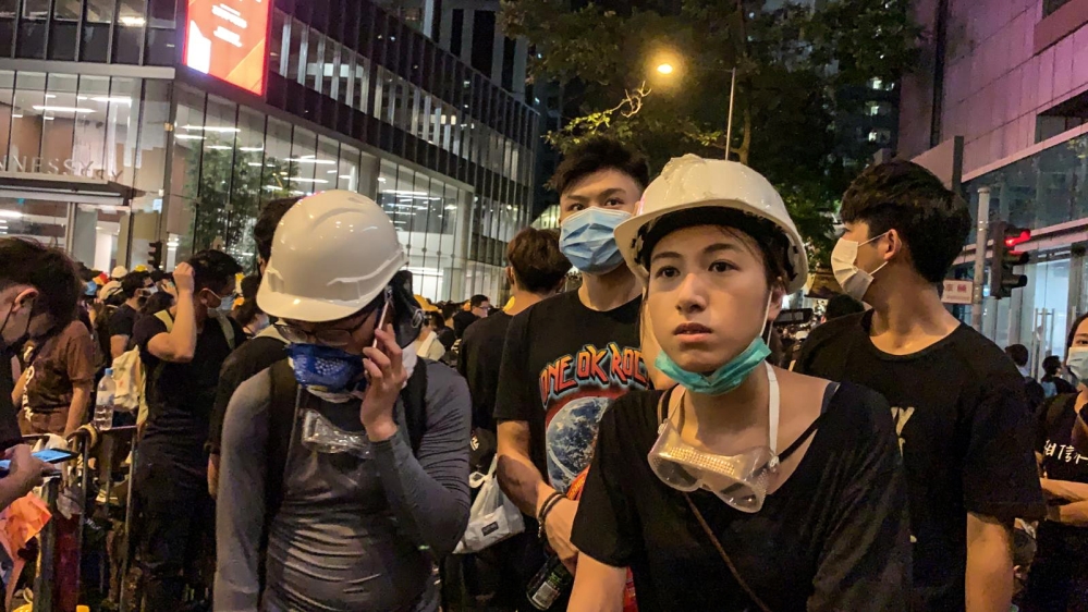 People protest outside police headquarters, demanding Hong Kong’s leaders to step down and withdraw the extradition bill