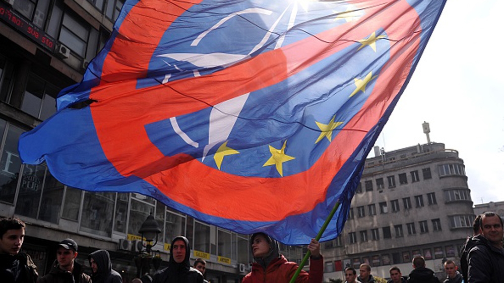 SERBIA-DEMO-NATO A man waves a flag during an Anti-NATO demonstration gathering several hundred people for a protest in downtown Belgrade, on March 27, 2016.