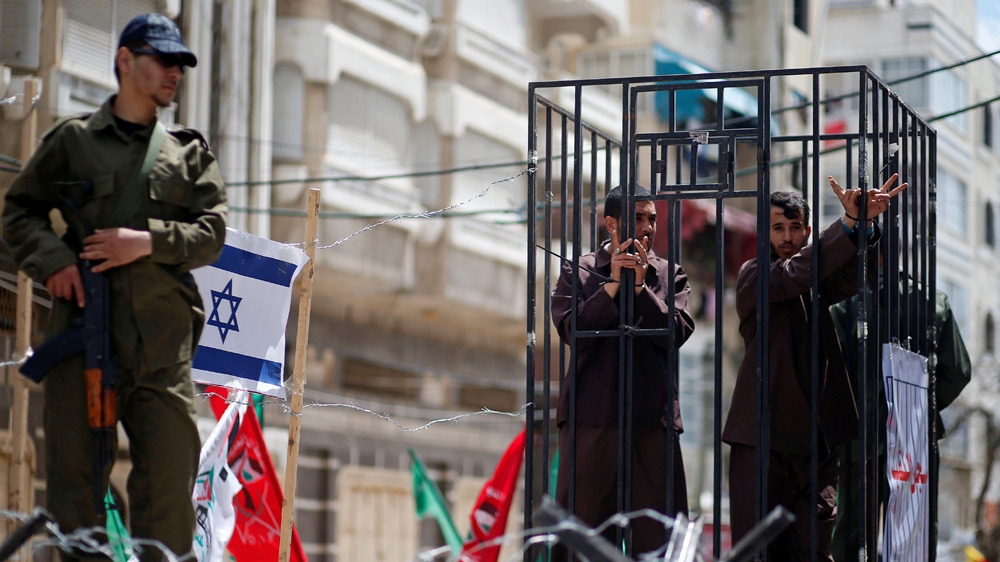 Men playing the role of [Palestinian prisoners