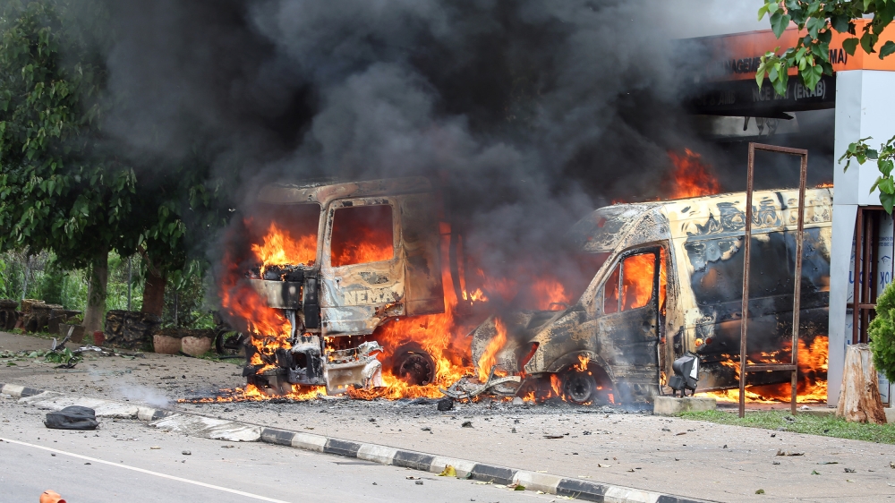 An ambulance and a fire engine set on fire by a Shi''ite group are seen at the Federal Secretariat in Abuja, Nigeria July 22, 2019. REUTERS/Afolabi Sotunde