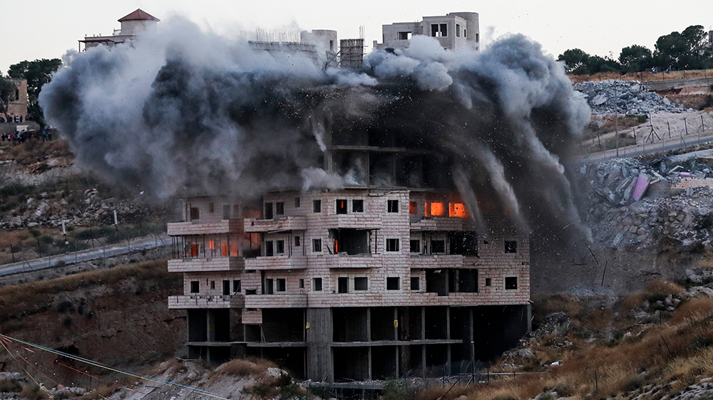 This picture taken on July 22, 2019, shows the demolition of a Palestinian building which was under construction, in the the Palestinian village of Sur Baher in East Jerusalem. - Israel demolished a n