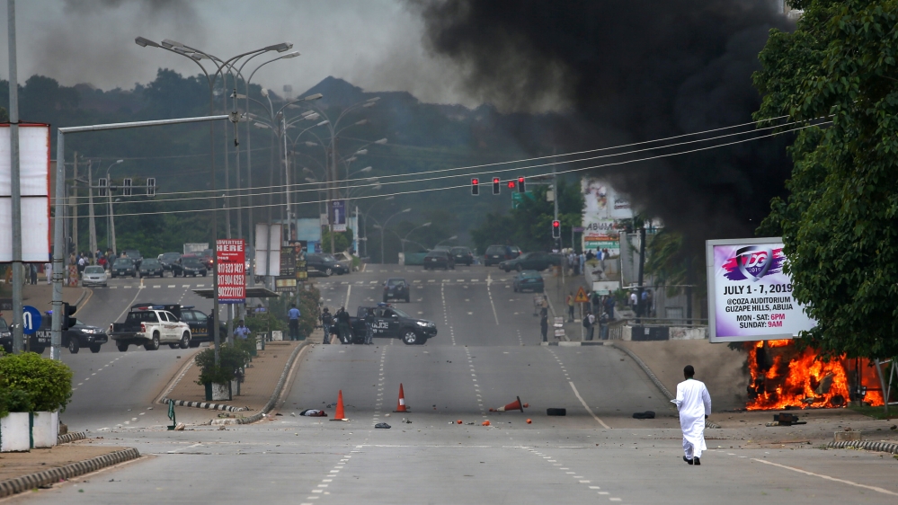 A member of the Shi''ite movement lies dead after the Shi''ite group set an ambulance and a fire engine on fire at the Federal Secretariat in Abuja