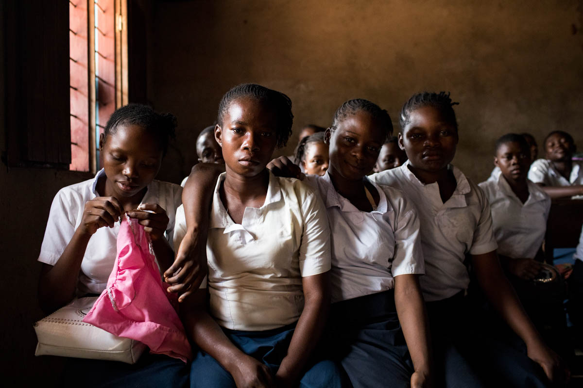 Former militiamen in their classrooms at Moyo Mopeluke School in Katanga. Many child soldiers were recruited by militiamen during the conflict. The program manager explains that when they arrive, the