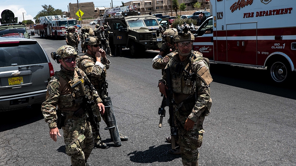 Law enforcement agencies respond to an active shooter at a Wal-Mart near Cielo Vista Mall in El Paso, Texas, Saturday, Aug. 3, 2019. - Police said there may be more than one suspect involved in an act