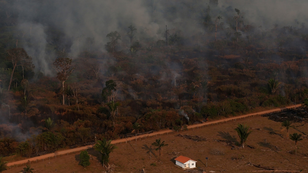 An aerial view of a burning tract of Amazon jungle as it is cleared by loggers and farmers near Porto Velho