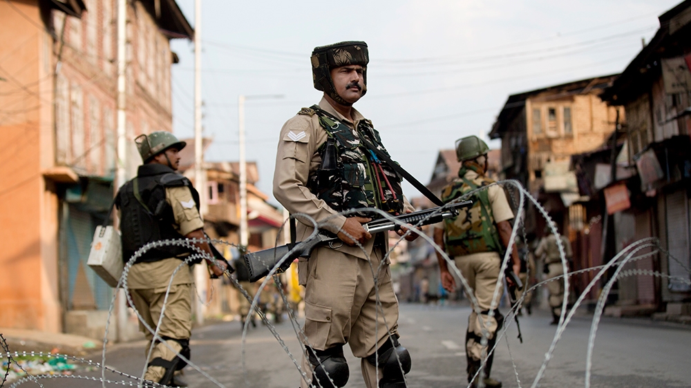Indian Paramilitary soldiers stand guard during curfew in Srinagar, Indian controlled Kashmir, Wednesday, Aug. 7, 2019. (AP Photo/ Dar Yasin)