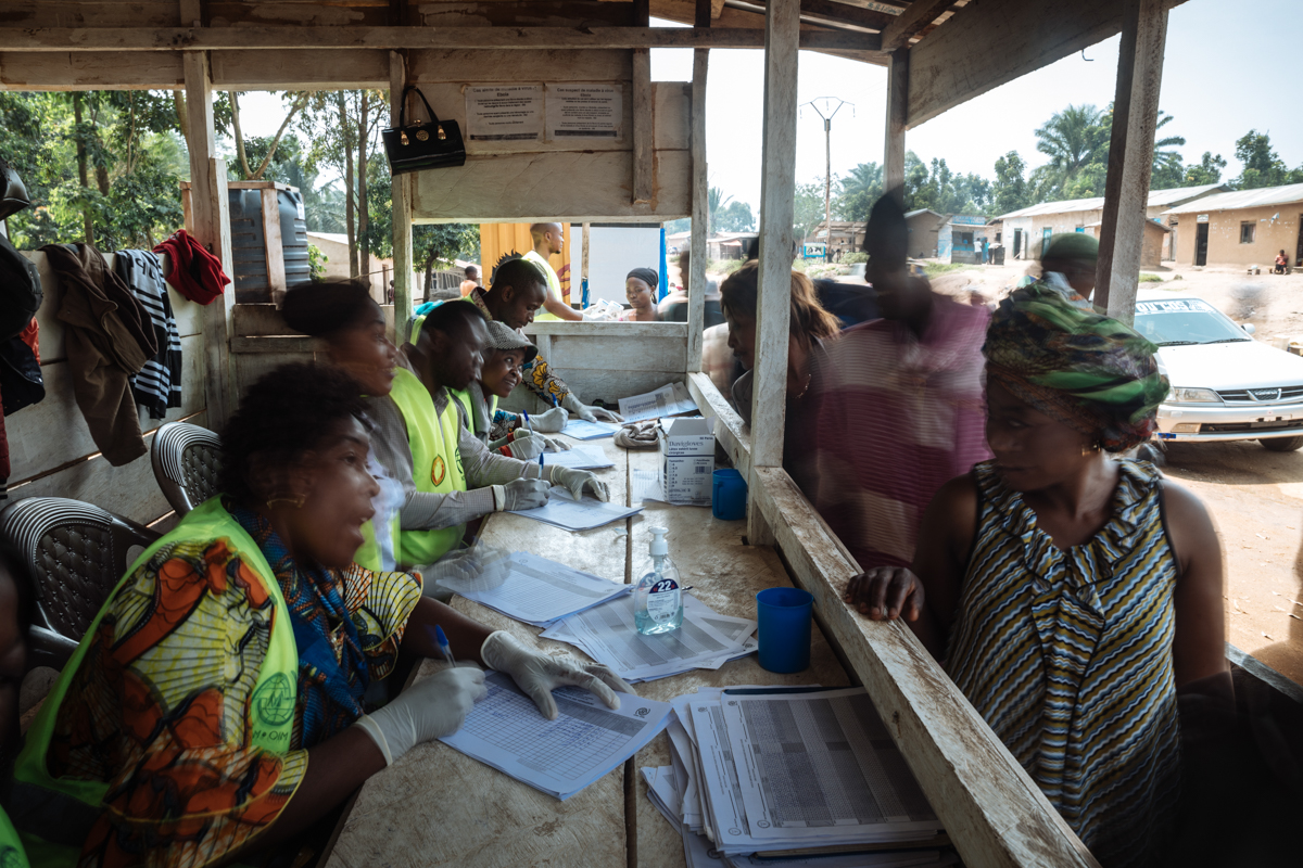 Frontline workers at Point of Control screening points register passengers, cross-checking names with a list of people who have been in contact with anyone infected with the disease. If a contact arri