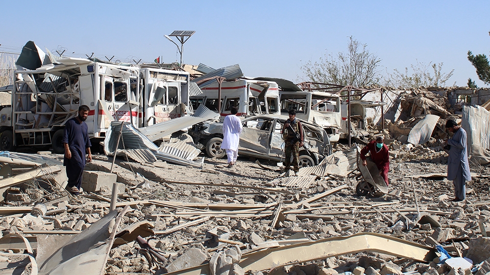 Afghan security forces investigate the site where a Taliban car bomb detonated near an intelligence services building in Qalat in Zabul province on September 19, 2019. - A car bomb attack targeting an