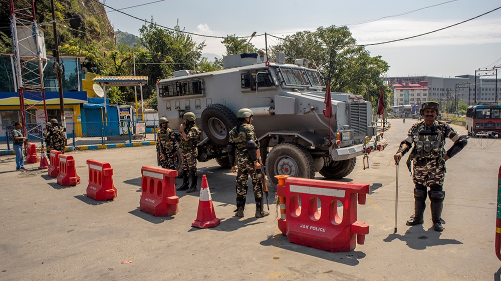 AUGUST 23: Indian paramilitary troopers stand guard as they seal the area leading to the office of United Nations Military Office Group In India and Pakistan (UNMOGIP) for a call to march towards UNMO