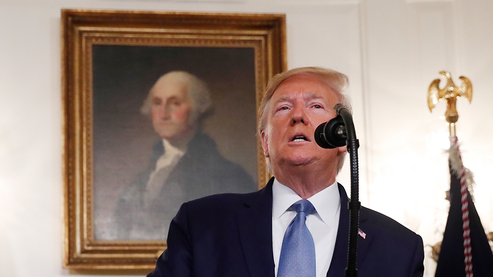 President Donald Trump, accompanied by Vice President Mike Pence, left, and Secretary of State Mike Pompeo, speaks Wednesday, Oct. 23, 2019, in the Diplomatic Room of the White House in Washington. (A