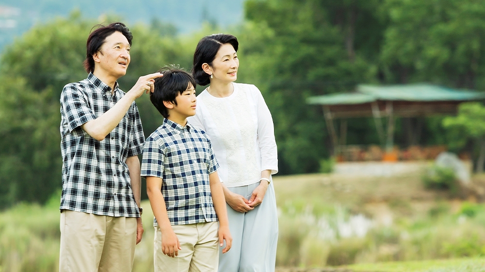 Prince Hisahito, centre, with his father Crown Prince Akishino, left, and his mother Crown Princess Kiko strolling around paddy fields in Bhutan; Prince Hisahito is second in line to the throne after his father, Prince Akishino; he turned 13 last month