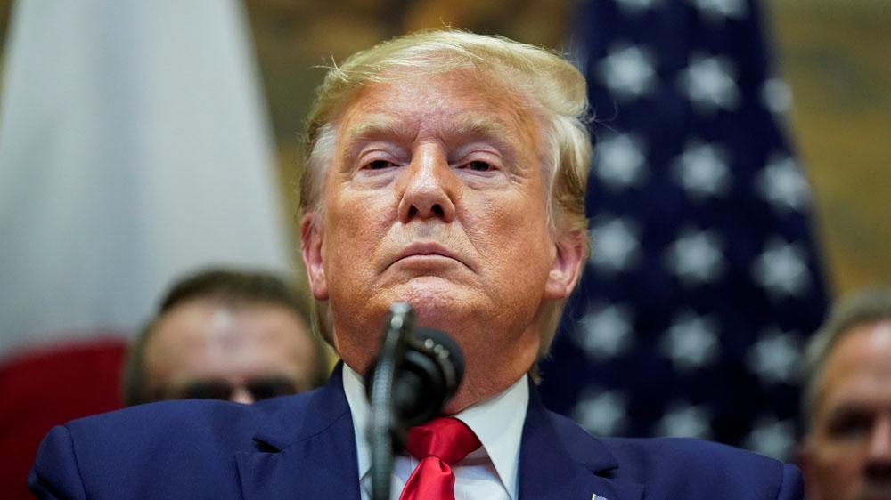 U.S. President Donald Trump speaks about impeachment investigation during signing ceremony for the U.S.-Japan Trade Agreement at White House in Washington