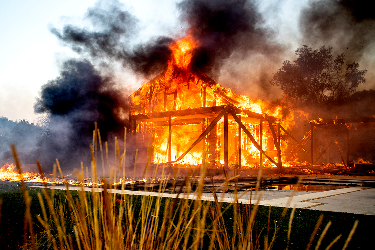Flames from the Kincade Fire consume a home in Healdsburg, Calif., on Sunday, Oct 27, 2019. (AP Photo/Noah Berger)