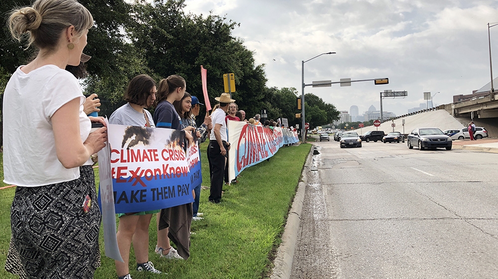 Protesters gather outside the ExxonMobil annual shareholder meeting last year to protest the company’s climate policies