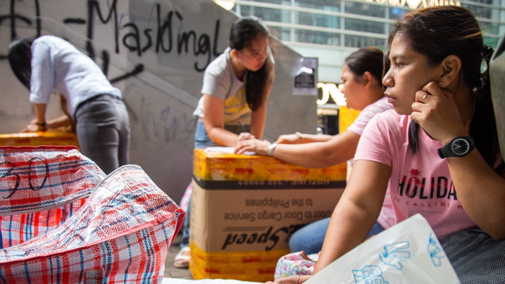 Women pack boxes to ship back to the Philippines on Oct. 7, 2019 in Central, Hong Kong’s business district and site of numerous anti-government protests over the past four months.