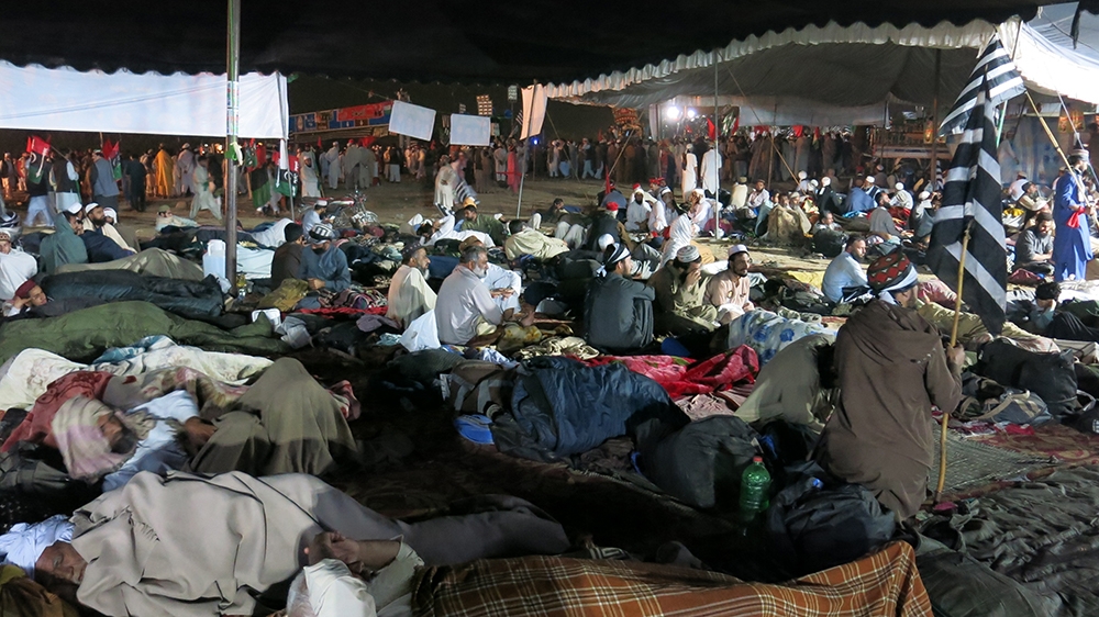Many people travelled long distances to attend the protest, and were instructed by protest leader Fazl-ur-Rehman to prepare to hold a prolonged sit-in [Asad Hashim/Al Jazeera]