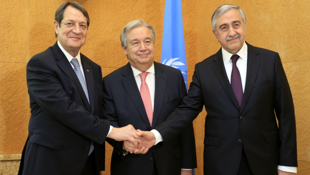 Cypriot President Anastasiades, UN Secretary General Guterres and Turkish Cypriot leader Akinci pose before a trilateral meeting ahead of the Conference on Cyprus at the UN in Geneva