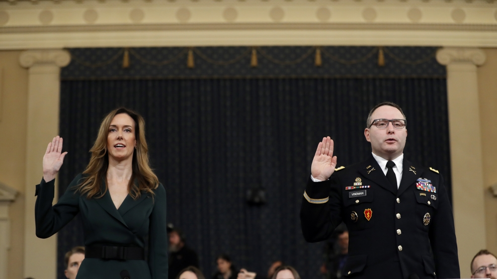 Jennifer Williams, an aide to Vice President Mike Pence, left, and National Security Council aide Lt. Col. Alexander Vindman, are sworn in to testify before the House Intelligence Committee on Capitol
