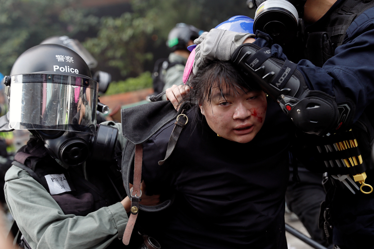 Police detain protesters who attempt to leave the campus of Hong Kong Polytechnic University (PolyU) during clashes with police in Hong Kong, China November 18, 2019. REUTERS/Tyrone Siu