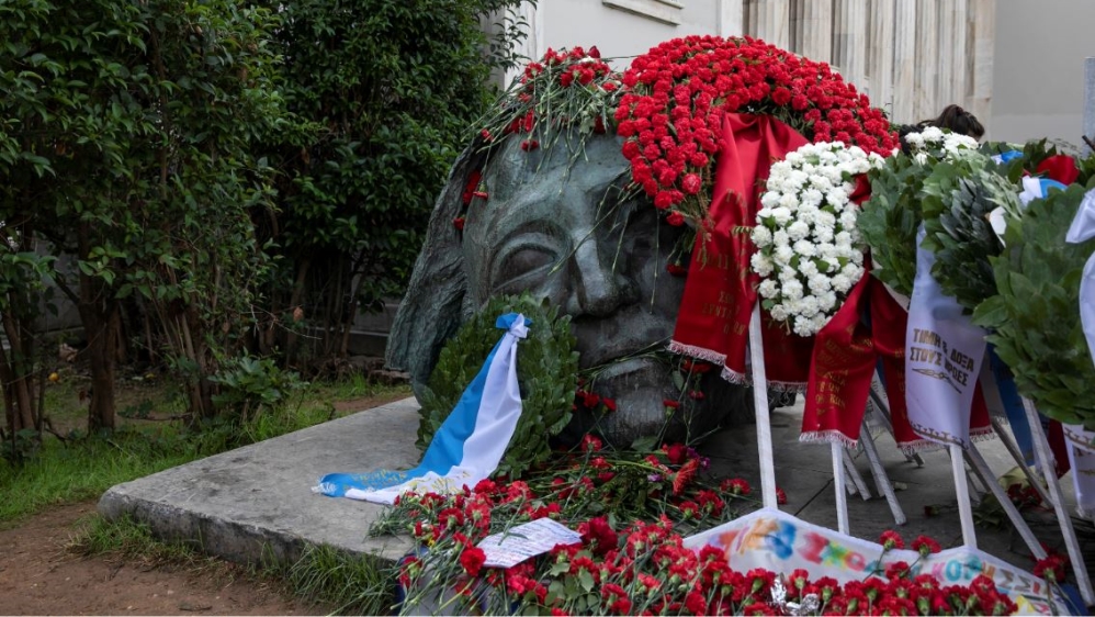 Flowers cover a part of a monument honouring students killed in a 1973 pro-democracy uprising