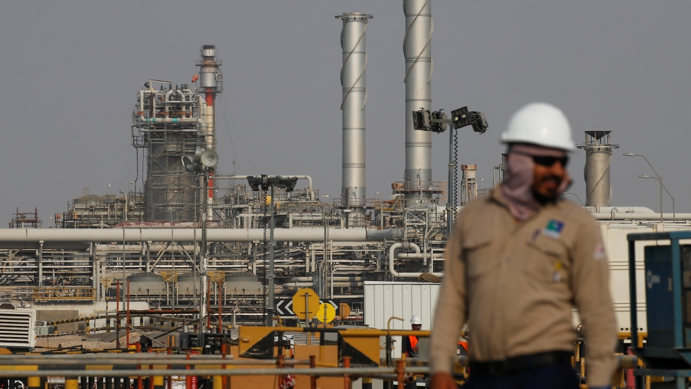 An employee looks on at Saudi Aramco oil facility in Abqaiq