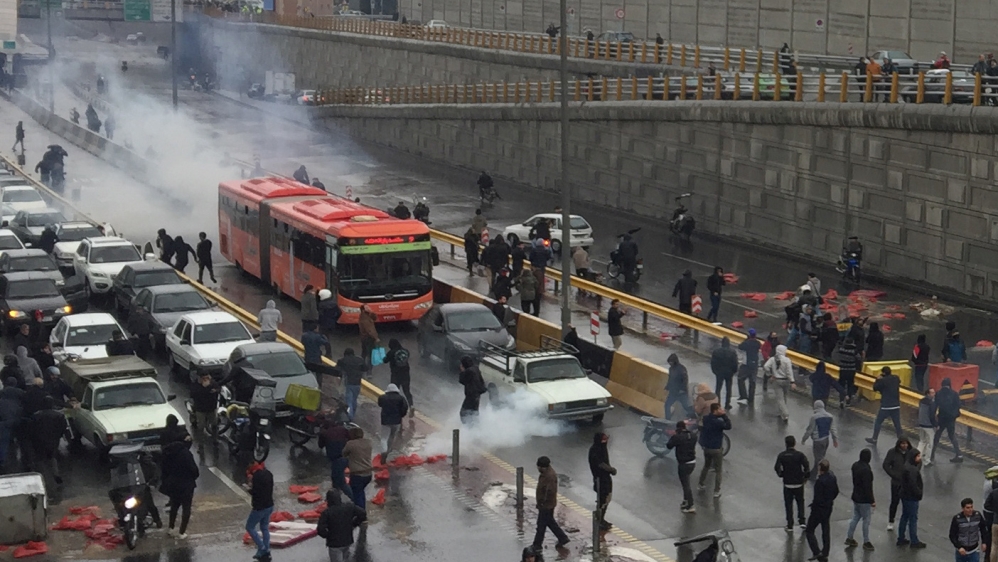 People protest against increased gas price, on a highway in Tehran, Iran November 16, 2019