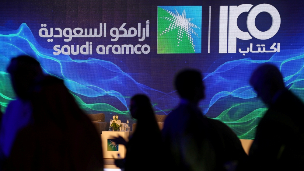 Sign of Saudi Aramco''s IPO is seen during a news conference by the state oil company in Dhahran