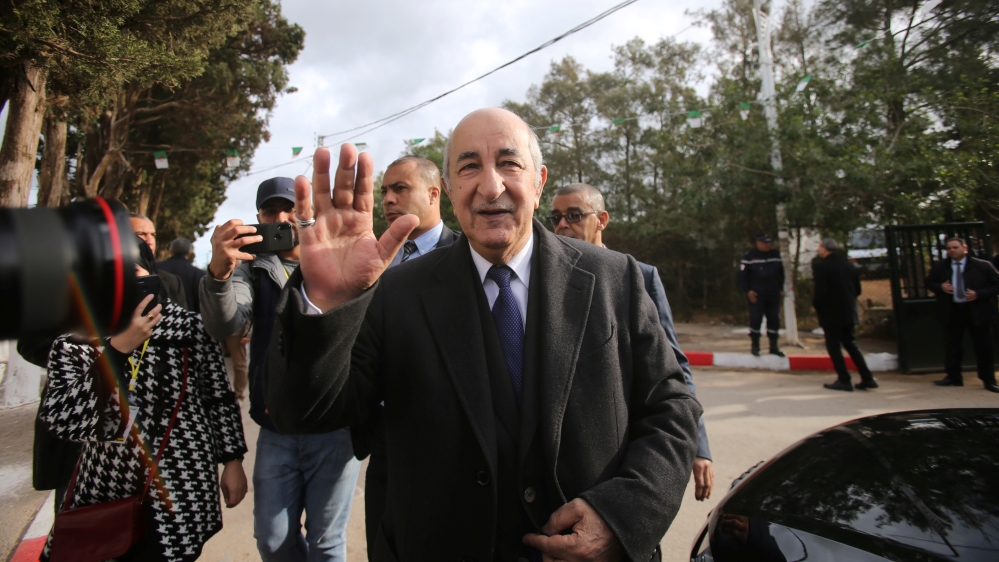 Algeria''s presidential candidate Abdelmadjid Tebboune greets attendees during the presidential election in Algiers