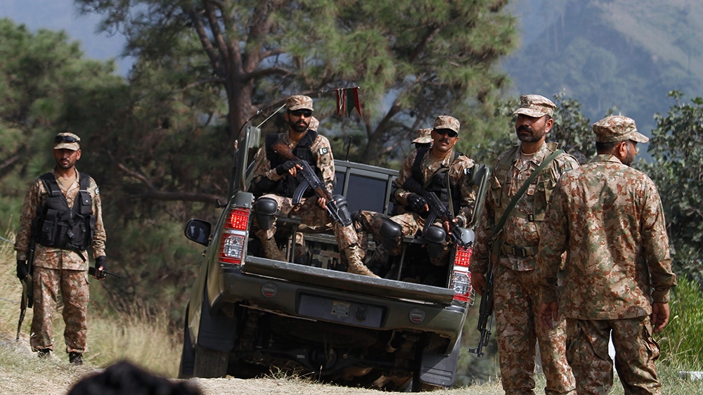Pakistan army soldiers patrol at a forward area Bagsar post on the Line of Control (LOC), that divides Kashmir between Pakistan and India, in Bhimber, some 166 kilometers (103 miles) from Islamabad, P
