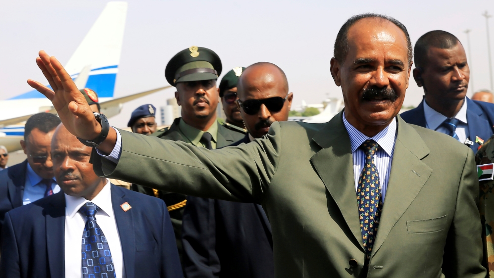 Eritrean President Isaias Afwerki waves upon his arrival for a state visit to Sudan at the Khartoum Airport