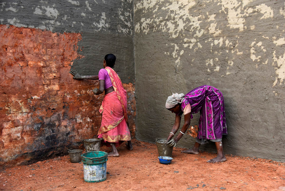 Labourers coat bricks with a mixture of mud and cow dung in a brick kiln at Langolpota village in North 24 Parganas district in the eastern state of West Bengal, India, November 26, 2019. Picture take