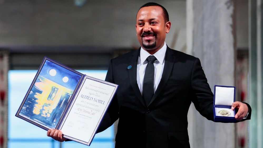 Ethiopian Prime Minister Abiy Ahmed Ali poses with medal and diploma after receiving Nobel Peace Prize during ceremony in Oslo City Hall