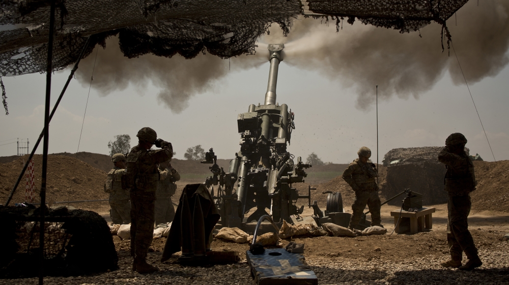 In this file photo from April 17, 2017, US soldiers from the 82nd Airborne Division fire artillery in support of Iraqi forces fighting ISIL from their base east of Mosul [File: Maya Alleruzzo/AP Photo